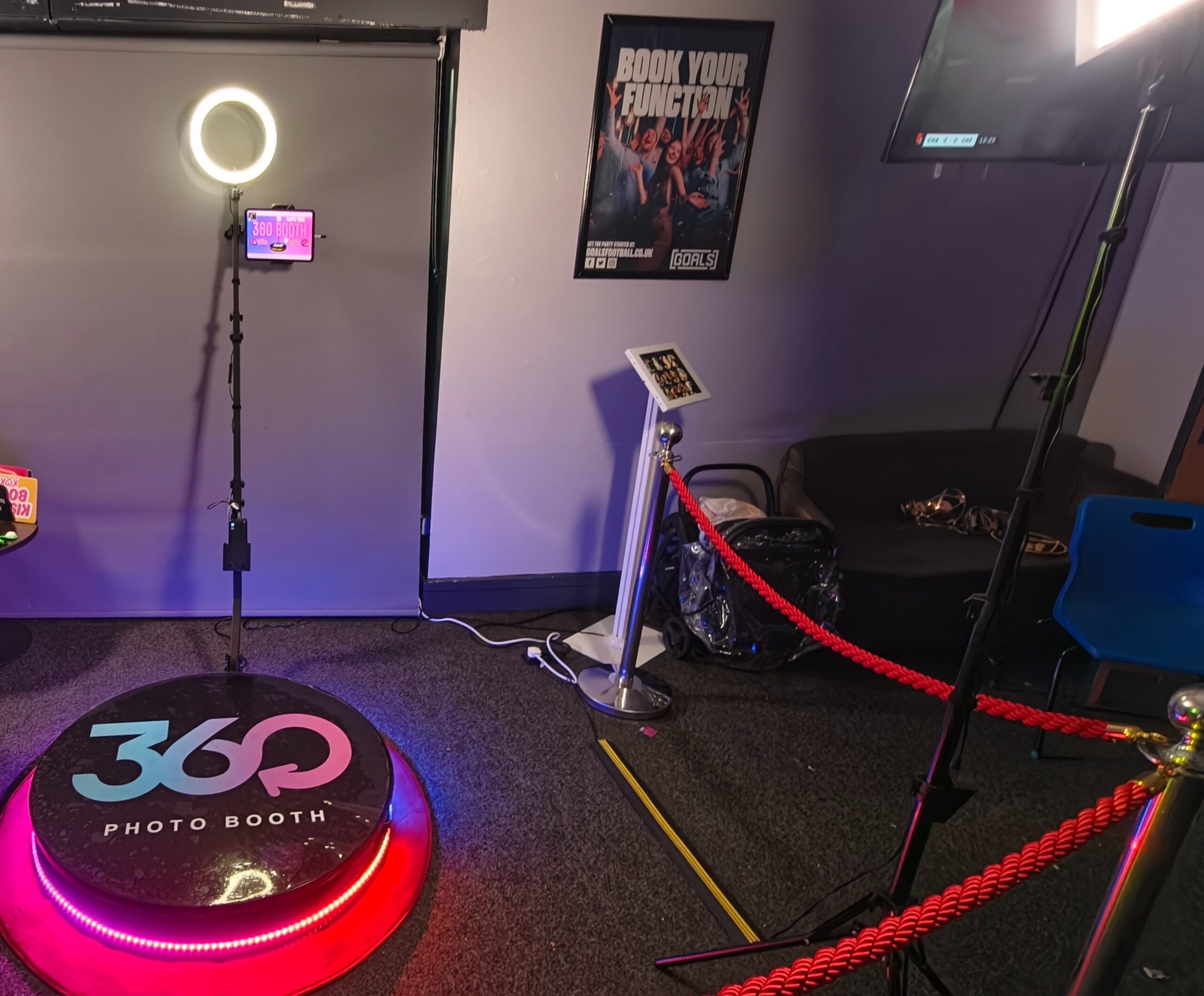 Disctilldawn 360 video booth setup with ring light and red rope barriers
