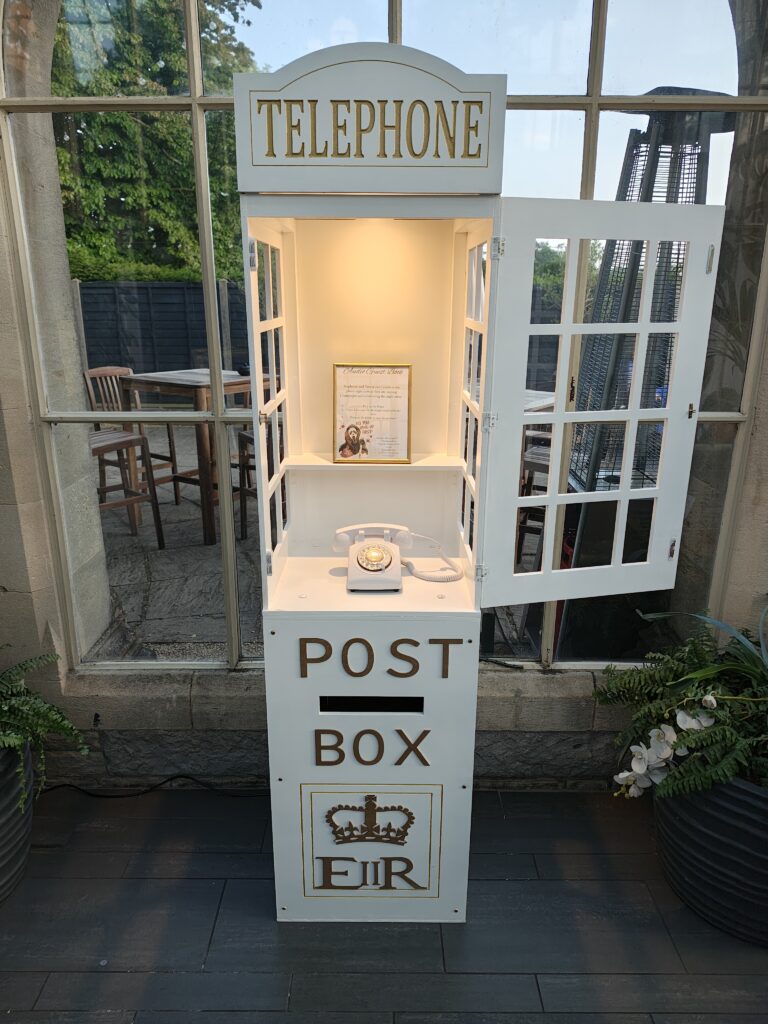 White telephone box and post box for the Disctilldawn Audio Guestbook
