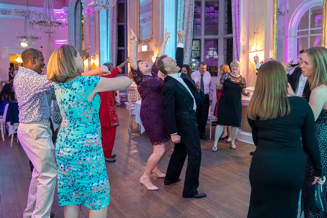 Guests sharing a dance at an elegant 70th birthday celebration