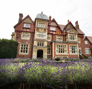 Pendley Manor wedding venue in Hertfordshire — Tudor-Gothic mansion with lavender garden in the foreground