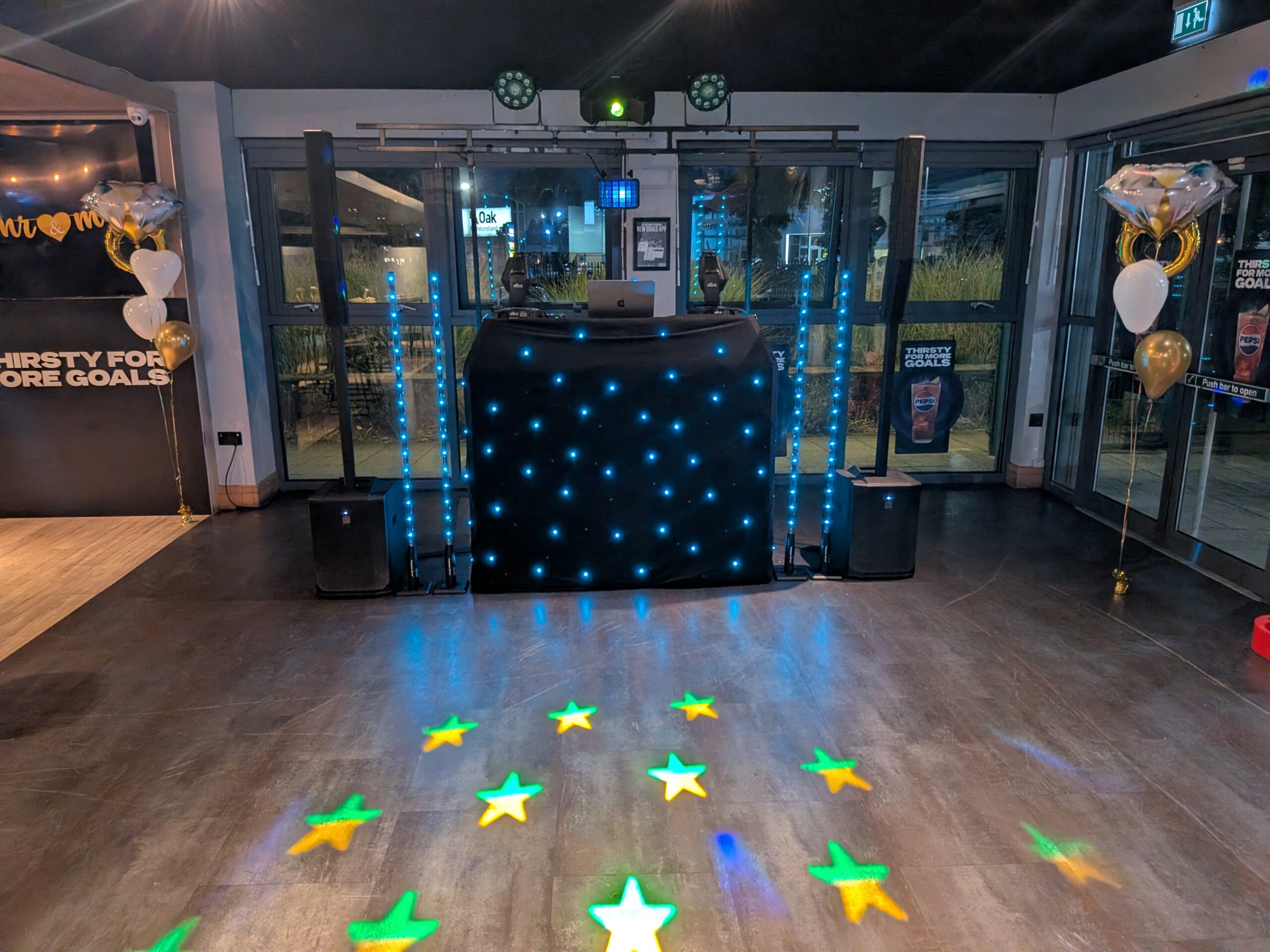 Classic disco service — black starlit DJ booth with star floor projections