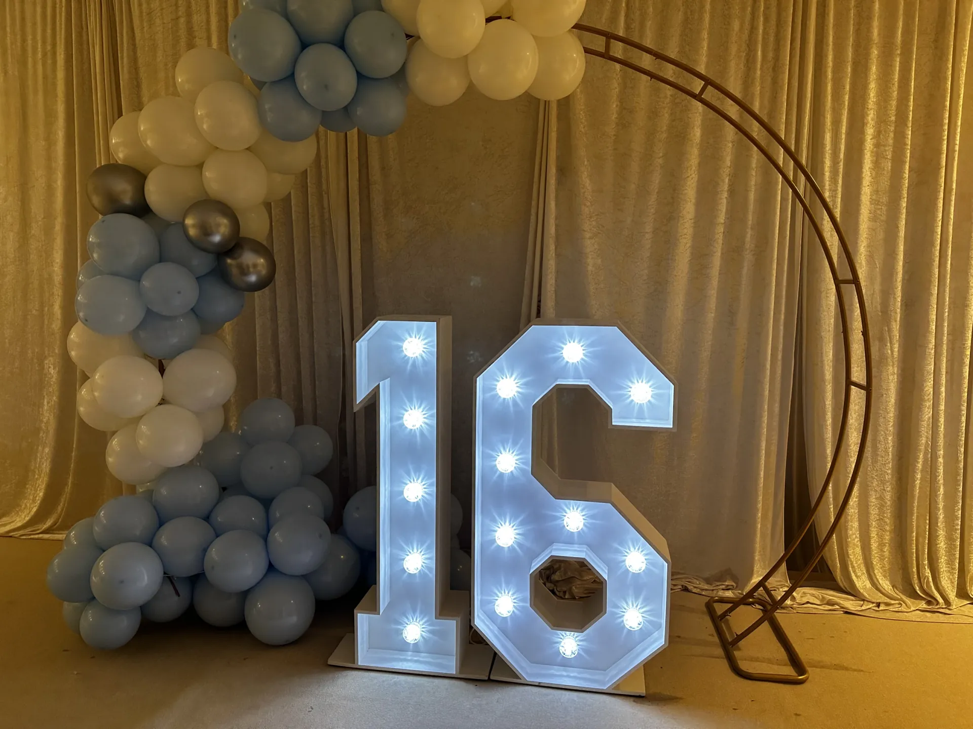 Illuminated number 16 display for a Sweet 16 birthday party
