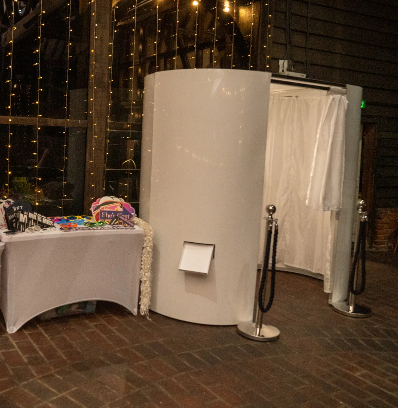 Classic enclosed photo booth with white skins