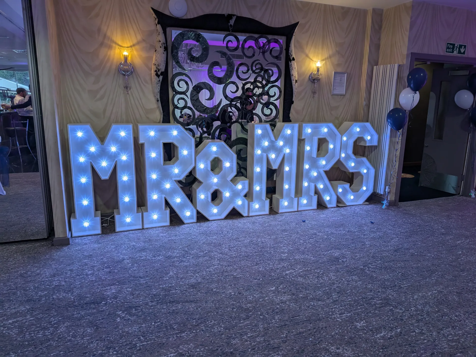 Light-up LOVE letters glowing on a wedding dance floor at a Disctilldawn-hired reception