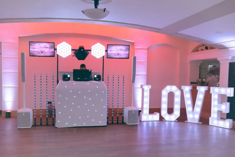 Large illuminated LOVE letters glowing at a wedding venue in Richmond