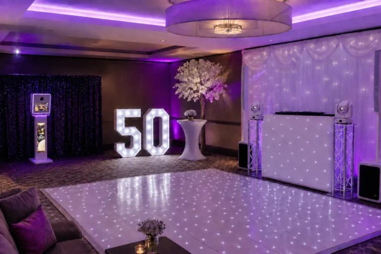 Complete party entertainment setup with DJ, photo booth, light-up numbers and starlit dance floor
